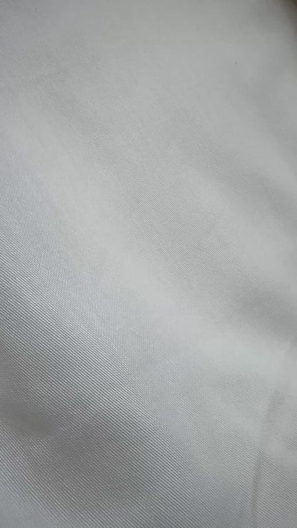 Ivory sateen fitted sheet styled on bed — soft, elegant, premium cotton bedding